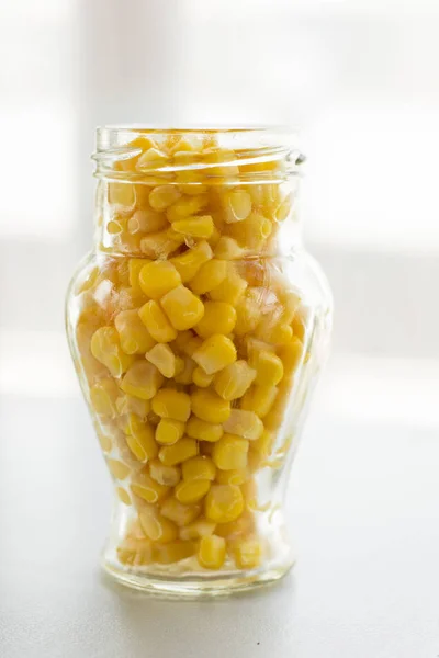 Pile Yellow Corn Grains Glass Jar Light Background Close — Stock Photo, Image