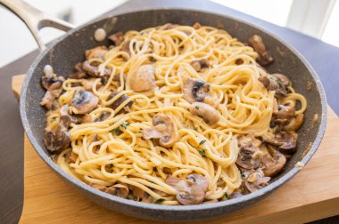 creamy mushroom pasta cooked in a pan, perfect for a cozy fall recipe