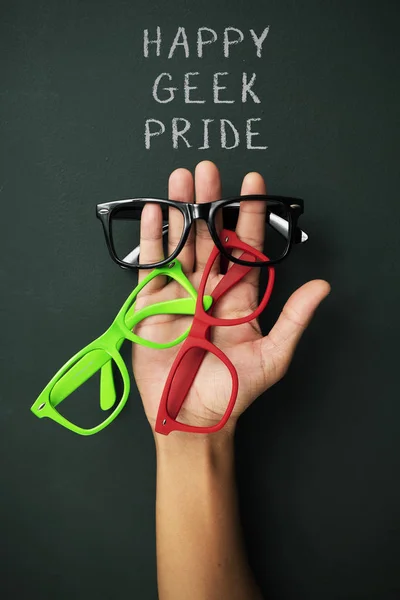 Some Plastic Rimmed Eyeglasses Different Colors Hand Young Man Text — Stock Photo, Image