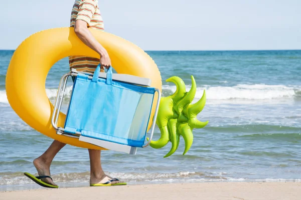 Closeup Young Caucasian Man Seashore Carrying Beach Chair Swim Ring — Stock Photo, Image