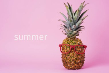 closeup of a pineapple wearing a pair of red eyeglasses and the text summer on a pink background clipart