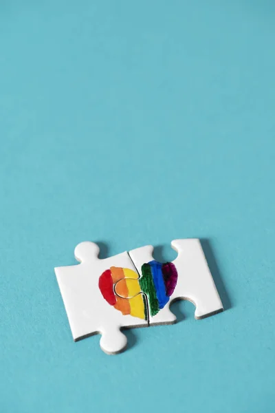 Two Pieces Puzzle Forming Rainbow Heart Blue Background Blank Space — Stock Photo, Image