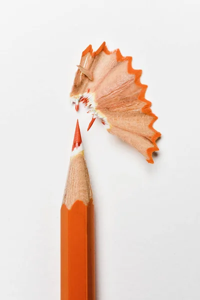 Closeup Orange Pencil Crayon Fan Shaped Shavings White Background — Stock Photo, Image