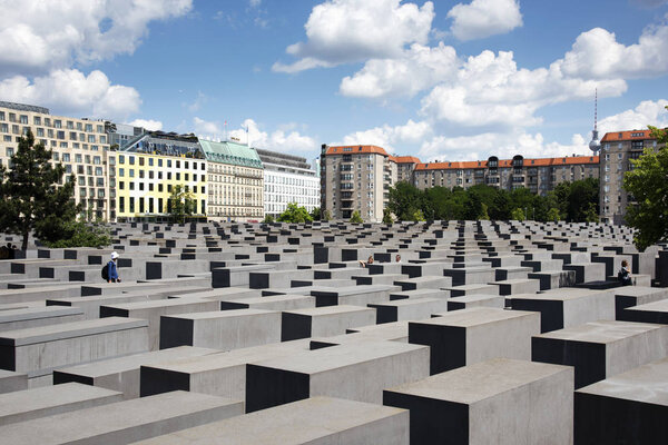 BERLIN, GERMANY - MAY 25, 2018: Visitors at the Memorial to the Murdered Jews of Europe, also known as Holocaust Memorial, in Berlin, Germany
