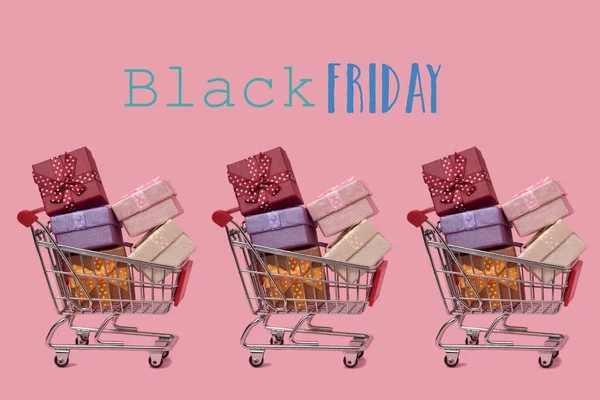 Three Shopping Carts Full Gifts Different Colors Text Black Friday — Stock Photo, Image