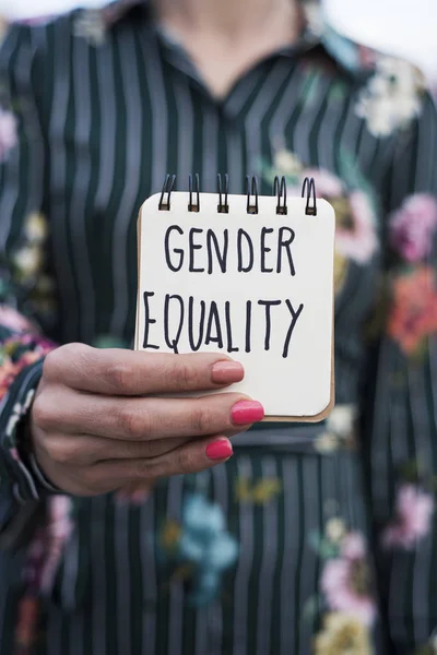 Closeup Young Woman Outdoors Showing Notepad Text Gender Equality Handwritten — Stock Photo, Image