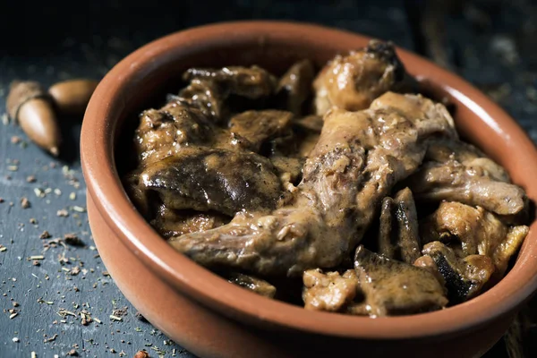 Closeup Earthenware Casserole Some Pieces Rabbit Prunes Mushrooms Typically Eaten — Stock Photo, Image