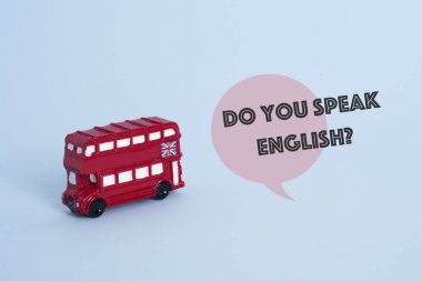 kırmızı çift katlı otobüs, Londra, İngiltere, tipik ve soru İngilizce biliyor musunuz? mavi bir arka plan üzerinde