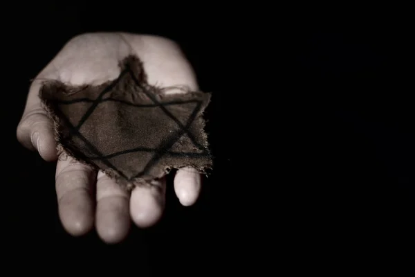 Closeup Ragged Jewish Badge Hand Man Dramatic Effect Black Background — Stock Photo, Image