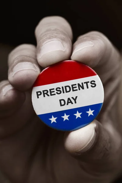 Close Hand Man Holding Pin Button Text Presidents Day Colors — стоковое фото