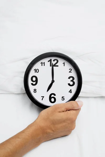 Closeup Hand Young Caucasian Man Grabbing Clock Seven Bed Dressed — Stock Photo, Image