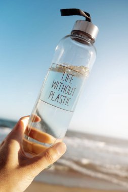 water bottle with the text life without plastic clipart