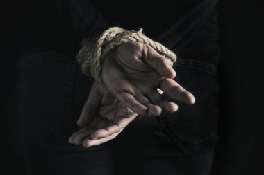 man with his hands tied behind his back clipart