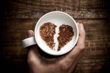 cup of cappuccino with a broken heart clipart