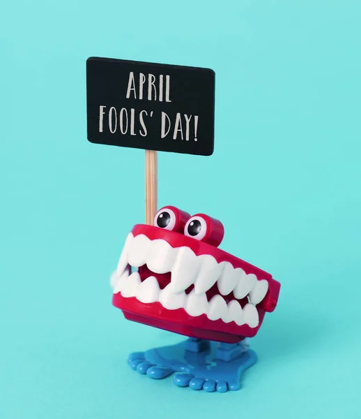 Funny denture and text april fools day — Stock Photo, Image