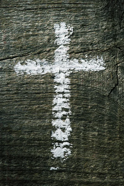 Christian cross on a wooden surface — Stock Photo, Image