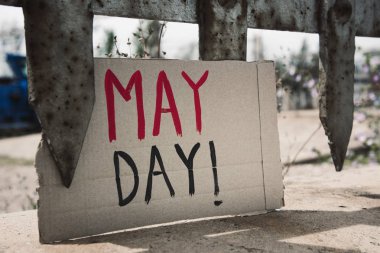 text may day in a brown cardboard signboard clipart