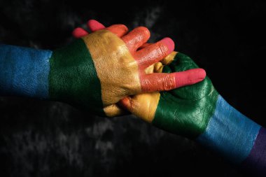 men holding hands patterned with the rainbow flag clipart