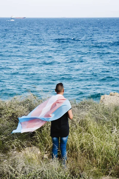 Young person with a transgender pride flag — ストック写真