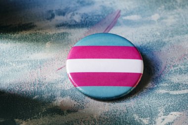 badge patterned with a transgender pride flag clipart