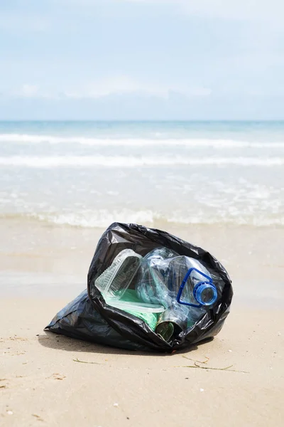 Garbage bag on the beach — Stock Photo, Image