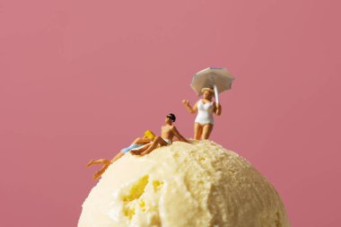 miniature people in swimsuit on an ice cream clipart