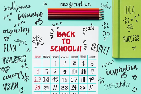 Calendar, pencil crayons and text back to school — Stock Photo, Image