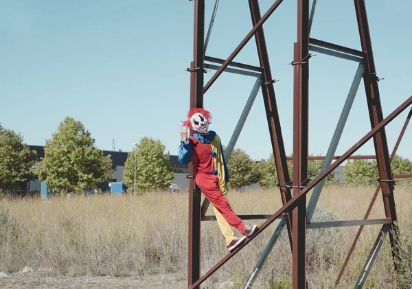 Scary clown on an abandoned billboar — Stock Photo, Image