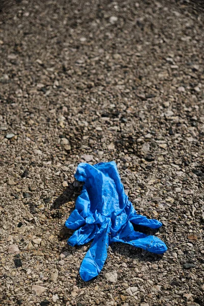Closeup Blue Used Latex Glove Thrown Asphalt Road Parking Lot — Stock Photo, Image