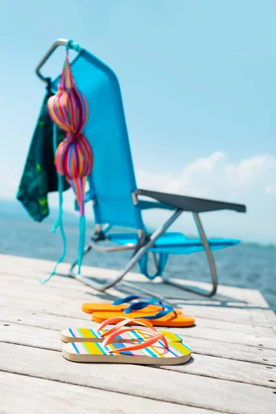 Colorful Bikini Pair Blue Swimming Trunks Drying Blue Deck Chair — Stock Photo, Image