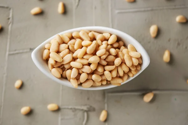 High Angle View White Ceramic Bowl Full Shelled Pine Nuts — Stock Photo, Image