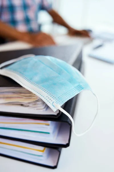 Closeup Blue Disposable Face Mask Office Desk Young Man Using — Stock Photo, Image