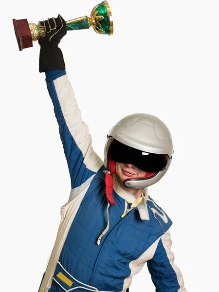 Portrait of a male racer winner with a gold trophy cup isolated on white — Stock Photo, Image