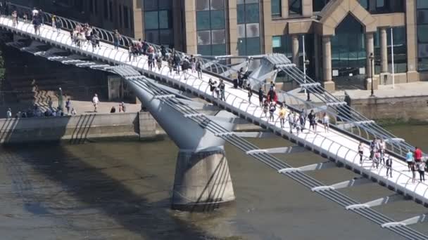 People on Millennium Bridge in London — Stock Video