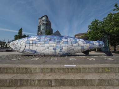 BELFAST, UK - CIRCA JUNE 2018: The Big Fish (akaThe Salmon of Knowledge) ceramic mosaic sculpture by John Kindness in Donegall Quay clipart