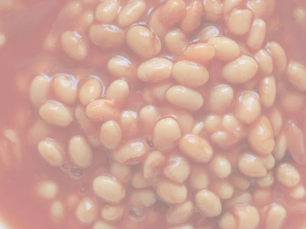 番茄酱中烘焙豆的细节 精致柔和的褪色色调作为背景 — 图库照片