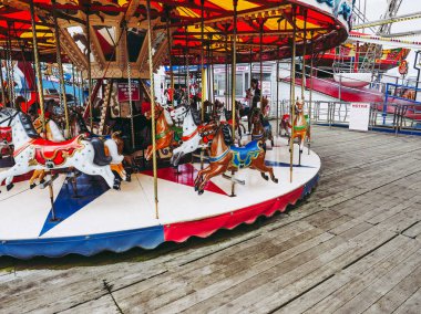 BLACKPOOL, UK - CIRCA JUNE 2016: Merry go round at Blackpool Pleasure Beach resort amusement park clipart