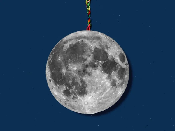 paper moon hanged with a rope over sky with stars, useful for merry christmas greeting cards