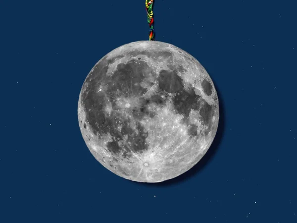 paper moon hanged with a rope over sky with stars, useful for merry christmas greeting cards