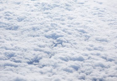 Yukarıda da görüleceği uçaktan yararlı bir arka plan beyaz bulutlar