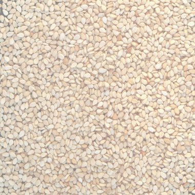 Bir yığın kahverengi sarı susam, hassas yumuşak sesi arka plan olarak yararlı soluk.