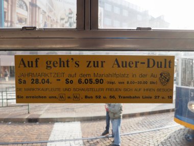 TURIN, ITALY - CIRCA DECEMBER 2018: Auf geht's zur Auer-Dult (Let's go to Auer-Dult) sign on vintage German tram