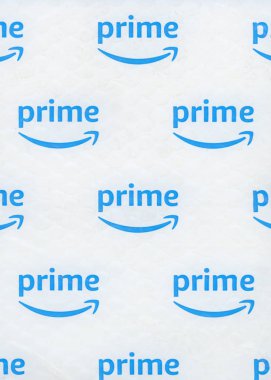SEATTLE, USA - CIRCA DECEMBER 2018: Amazon Prime logo on a packet. Members of Prime receive benefits which include free fast shipping for eligible purchases, streaming of movies, TV shows and music clipart