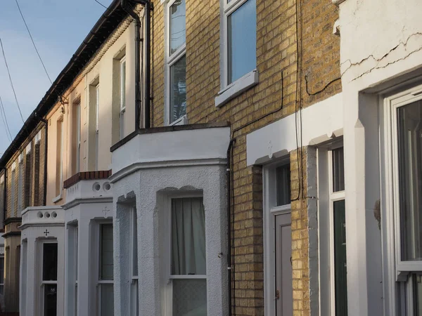 Row of traditional British houses with bow windows