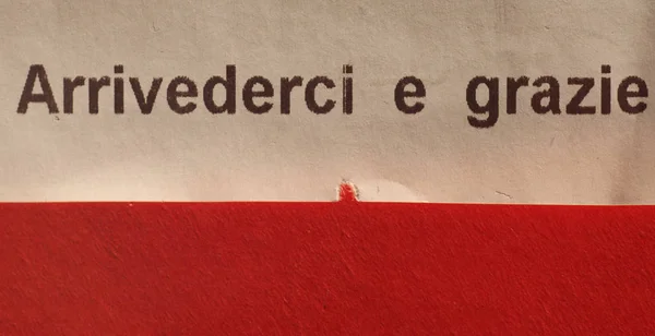 arrivederci e grazie (meaning see you again and thank you) written on Italian supermarket receipt