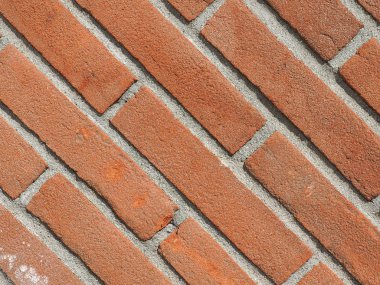 kırmızı tuğla çapraz çinileri ile arka plan olarak yararlı duvar