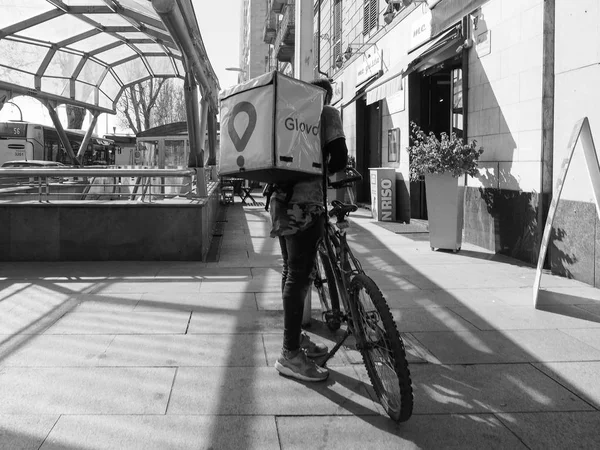 Glovo courier in Turin in black and white — Stock Photo, Image