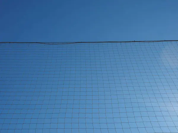 Net sobre azul céu textura fundo — Fotografia de Stock