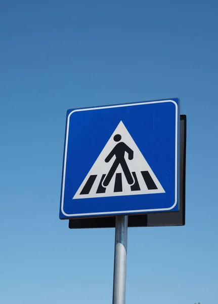 Zebra crossing sign over blue sky — 스톡 사진