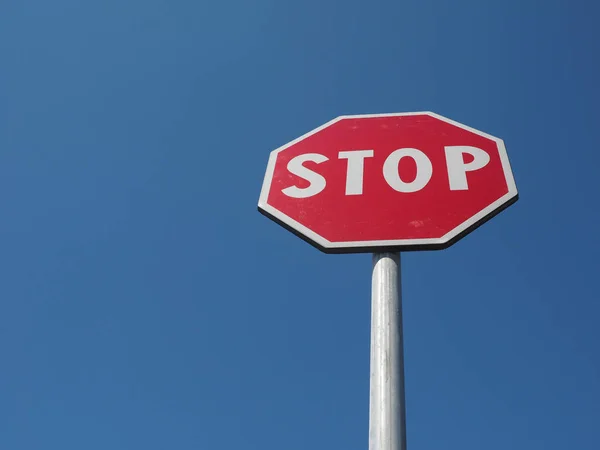 Stop sign over blue sky Royalty Free Stock Photos